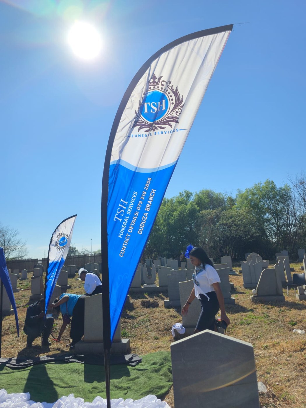 TSH Funeral Services flag at an outdoor service